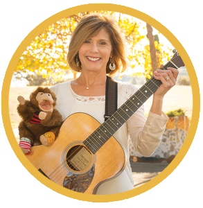 Joni DeGabriele of Musical Moments with puppet Spunky the Monkey